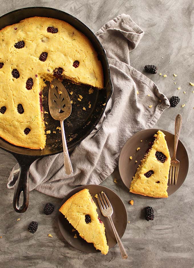 Zucchini Blackberry Cornbread (Gluten Free) - Tender sweet cornbread that's studded with juicy blackberries. The shredded zucchini replaces a lot of oil while keeping it moist. The perfect cornbread recipe for holidays and parties! Seriously the BEST cornbread I've had! (Dairy free adaptable) | robustrecipes.com
