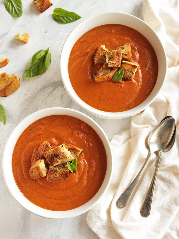 15 Minute Creamy Tomato Basil Soup is thick, creamy, and bursting with tomato and basil flavor. It only requires 8 simple ingredients and 15 minutes to make. It's the perfect fall/winter meal or side. So comforting and tasty! Also great for weeknight meals and freezes well. (Gluten Free, Vegan, Vegetarian, Dairy Free) | robustrecipes.com