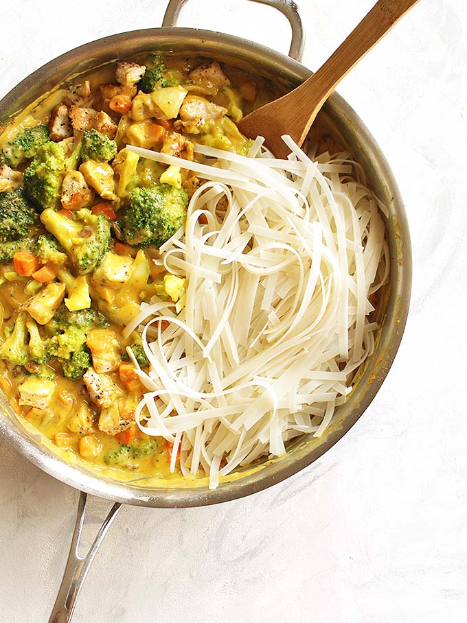 Mango Coconut Curry Chicken with Rice Noodles - A sweet and savory mango coconut curry sauce with chicken, rice noodles, broccoli and carrots. A great weeknight meal and the leftovers are perfect for lunch the following day. We love this recipe in the fall! Gluten Free/Dairy Free. | robustrecipes.com