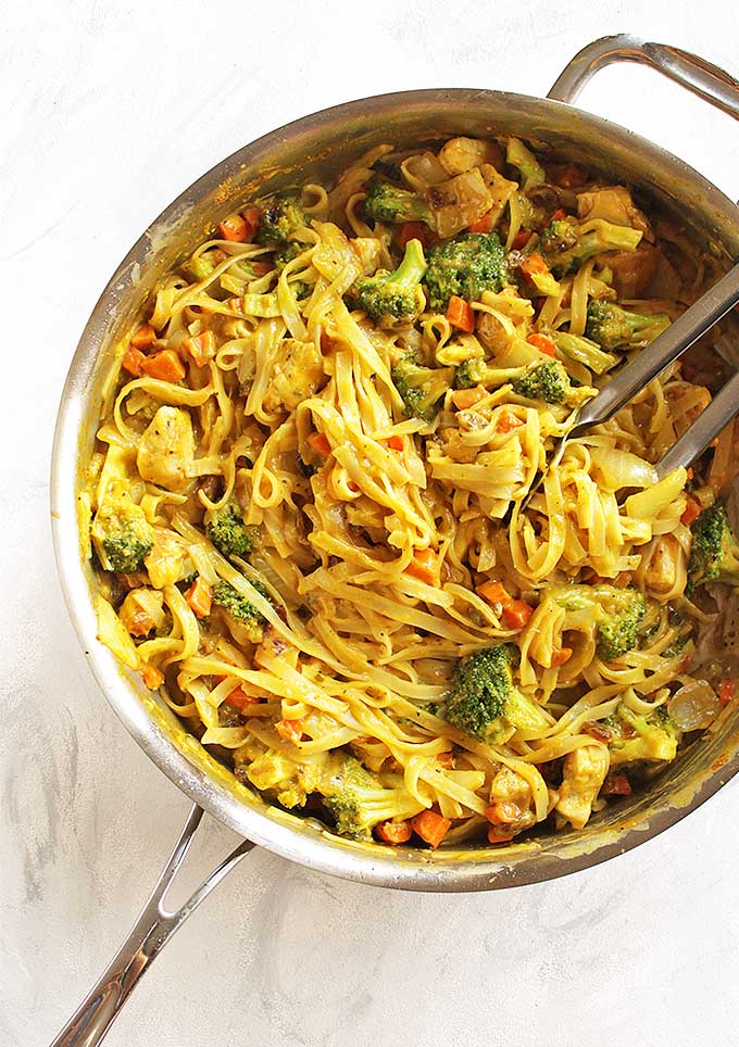 Mango Coconut Curry Chicken with Rice Noodles - A sweet and savory mango coconut curry sauce with chicken, rice noodles, broccoli and carrots. A great weeknight meal and the leftovers are perfect for lunch the following day. We love this recipe in the fall! Gluten Free/Dairy Free. | robustrecipes.com