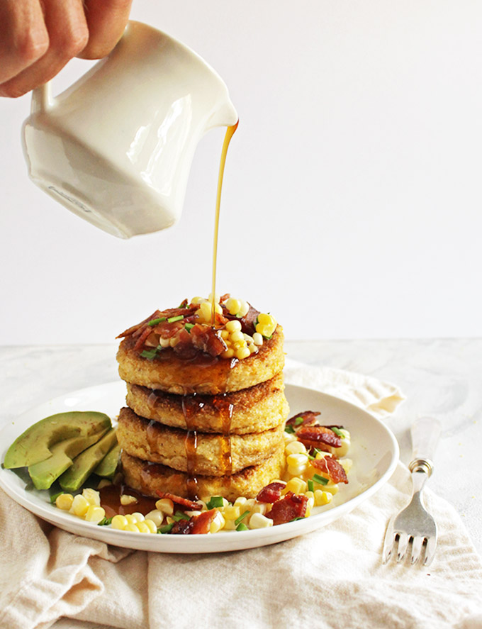 Cornmeal Pancakes with Bacon and corn (gluten free) - Savory cornmeal pancakes that are topped with crispy, salty bacon, fresh corn kernels, avocado slices, chives and a drizzle of maple syrup. These pancakes are that perfect balance of savory with a hint of sweetness. The ultimate weekend morning breakfast, especially when served along side some eggs. This recipe is dairy free adaptable and gluten free! So yum! | robustrecipes.com