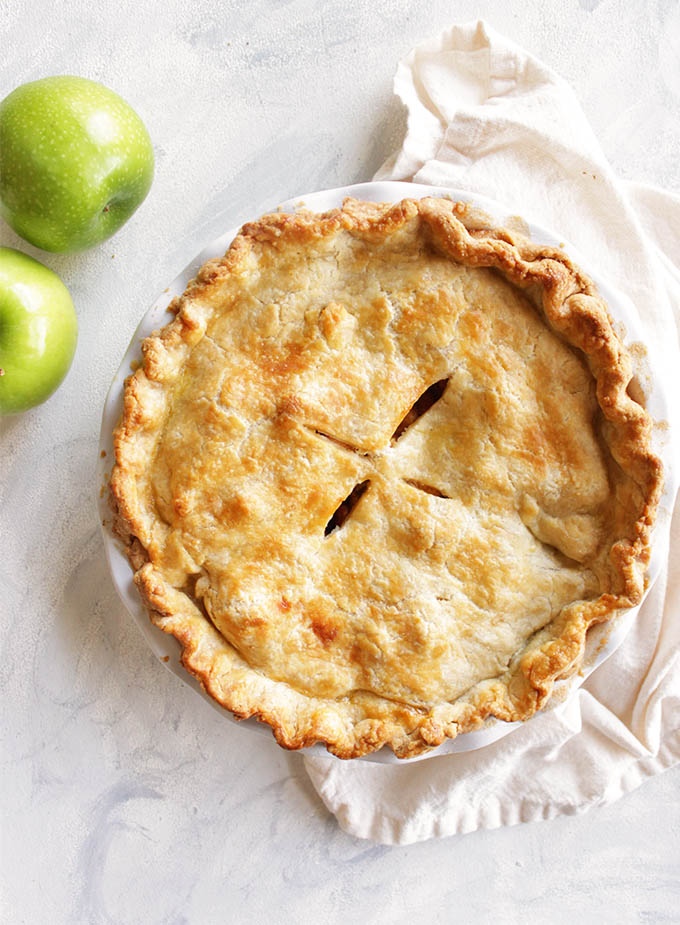 The perfect gluten free apple pie recipe! The apples are perfectly baked and the crust is flaky, buttery, and tender - no one will know it's gluten free. This pie makes a great Thanksgiving or Christmas dessert. So Yum! Also great for fall baking! | robustrecipes.com