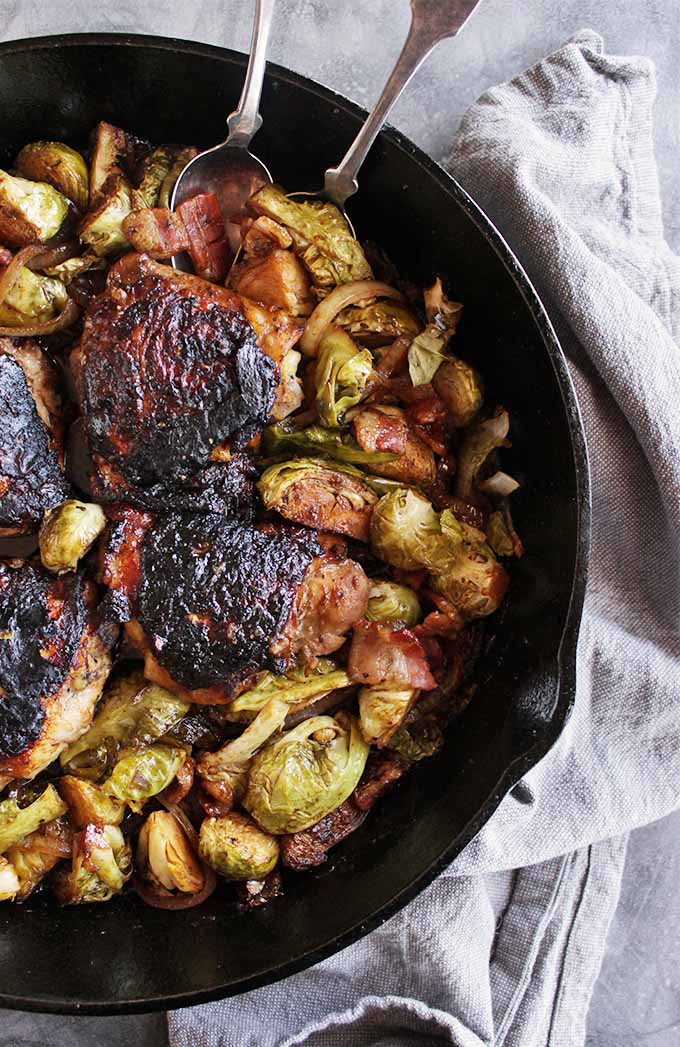 One pan maple chicken with Brussels sprouts and bacon - EASY recipe to make and feels elegant. Tender Brussels sprouts and bacon with maple marinated chicken. Salty, sweet, savory and so good! Perfect for a date night in or to serve to friends. LOVE this recipe!!! (Gluten Free & Dairy Free) | robustrecipes.com