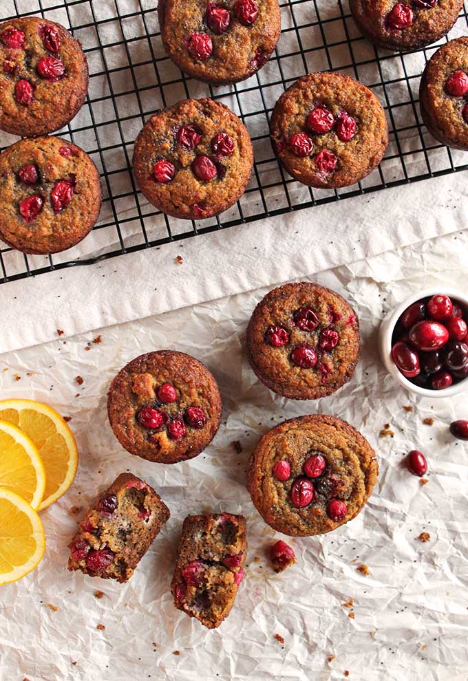 Gluten free cranberry orange muffins - the perfect balance of sweet and tart. They are packed with orange-y goodness, studded with juicy cranberries and crunchy poppy seeds. They are the perfect recipe for fall or any holiday - Thanksgiving or Christmas. | robustrecipes.com