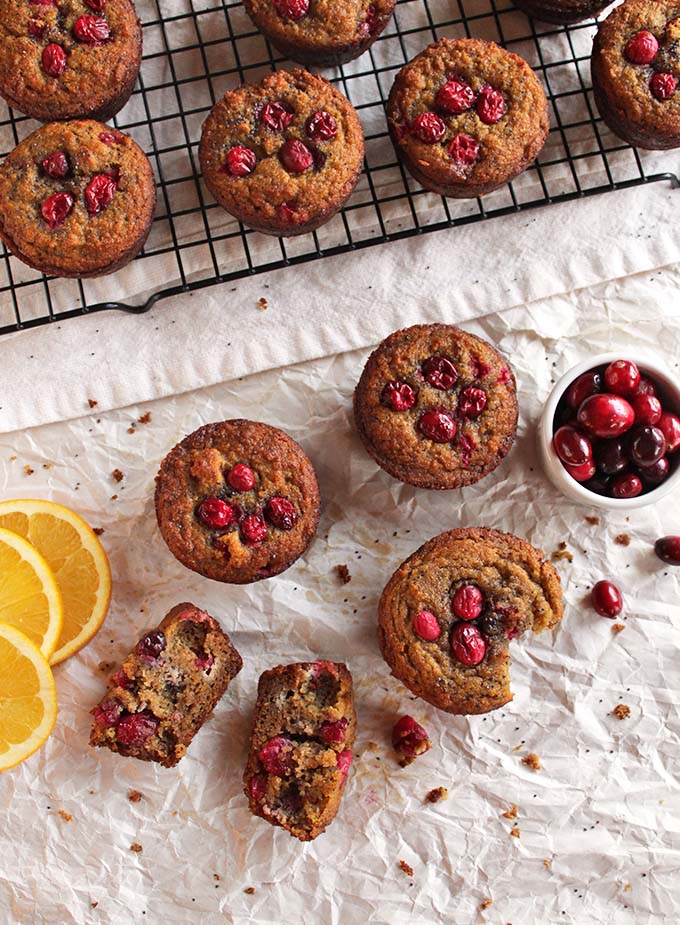 Gluten free cranberry orange muffins - the perfect balance of sweet and tart. They are packed with orange-y goodness, studded with juicy cranberries and crunchy poppy seeds. They are the perfect recipe for fall or any holiday - Thanksgiving or Christmas. | robustrecipes.com