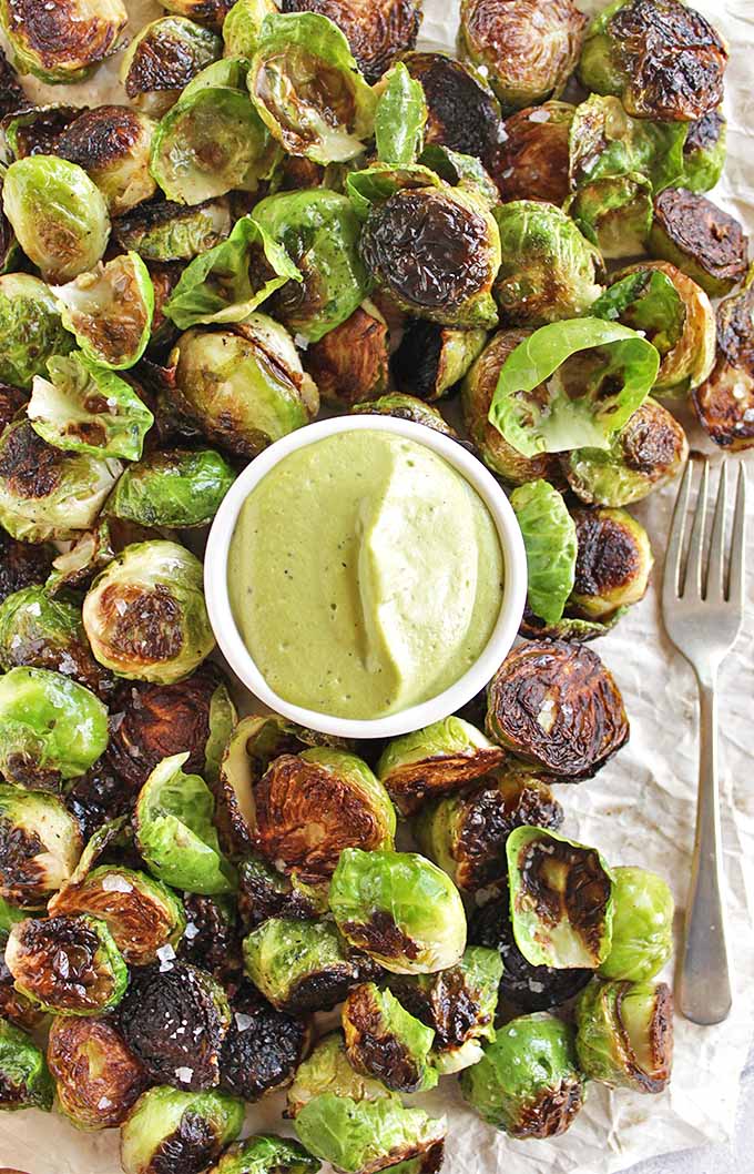 Crispy Brussels Sprouts with Basil Cashew Sauce - Crispy Brussels sprouts served with an AMAZING creamy basil cashew sauce for dipping. This recipe makes a great appetizer for parties or Thanksgiving and Christmas. So YUM!!! (Vegan/Dairy Free/Gluten Free) | robustrecipes.com