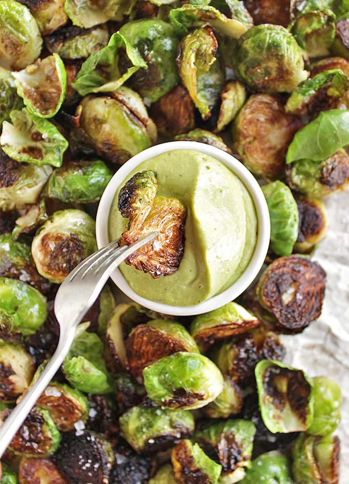 Crispy Brussels Sprouts with Basil Cashew Sauce - Crispy Brussels sprouts served with an AMAZING creamy basil cashew sauce for dipping. This recipe makes a great appetizer for parties or Thanksgiving and Christmas. So YUM!!! (Vegan/Dairy Free/Gluten Free) | robustrecipes.com