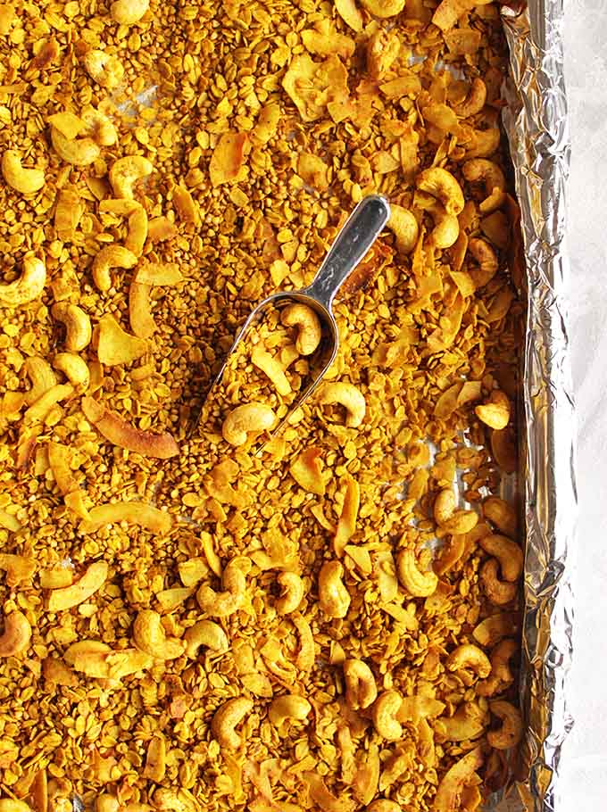Favorite golden granola - Golden granola, to start your day off right. Packed with good-for-you turmeric and super crunchy ingredients: rolled oats, buckwheat, cashews, flaked coconut! Naturally sweetened with maple syrup. Eat it plain or sprinkle it on yogurt. So yum! (Gluten Free, Vegan, Dairy Free) | robustrecipes.com