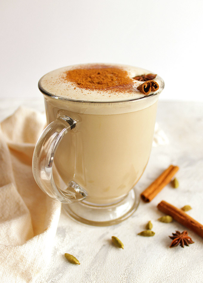 Coconut whiskey chai latte - Coconut chai latte meets whiskey. Whiskey chai latte is an indulgent cocktail that's the perfect way to cozy up and wind down during the fall or winter. So delicious with all of those chai spices: cardamom, ginger, cinnamon, and cloves. Made using a bagged chai tea, super easy recipe! This drink is vegan and dairy free with a gluten free option (swap the whiskey for spiced rum!).