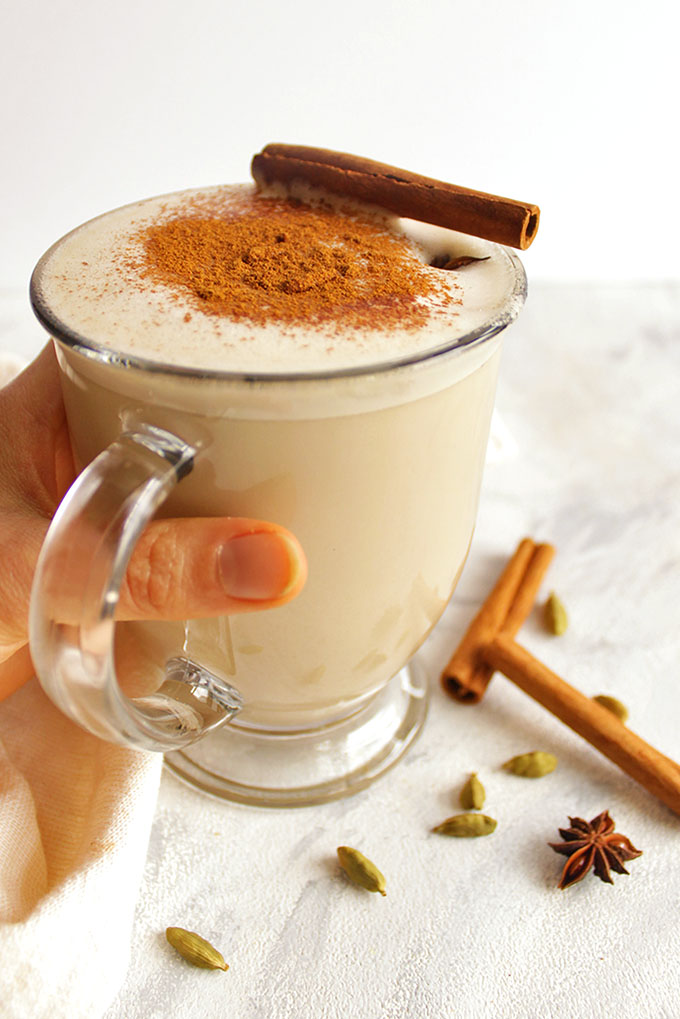 Coconut whiskey chai latte - Coconut chai latte meets whiskey. Whiskey chai latte is an indulgent cocktail that's the perfect way to cozy up and wind down during the fall or winter. So delicious with all of those chai spices: cardamom, ginger, cinnamon, and cloves. Made using a bagged chai tea, super easy recipe! This drink is vegan and dairy free with a gluten free option (swap the whiskey for spiced rum!).