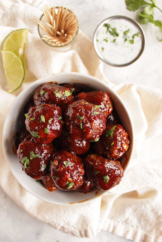 Spicy chipotle honey meatballs with cooling lime cilantro sauce - The perfect appetizer recipe for any party. Spicy, sweet, and smoky with a cooling cilantro lime sauce. Super easy to make. (Gluten Free) | robustrecipes.com