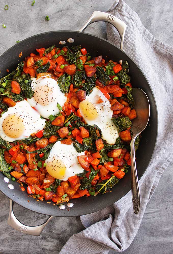 30 Minute Plantain Breakfast Hash with Runny Eggs - Loaded with savory veggies, smoked paprika, and slightly sweet and starchy plantains. All of that is topped with a runny egg! Only requires 1 pan and 30 minutes! The perfect weekend breakfast! (Gluten Free & vegetarian) | robustrecipes.com
