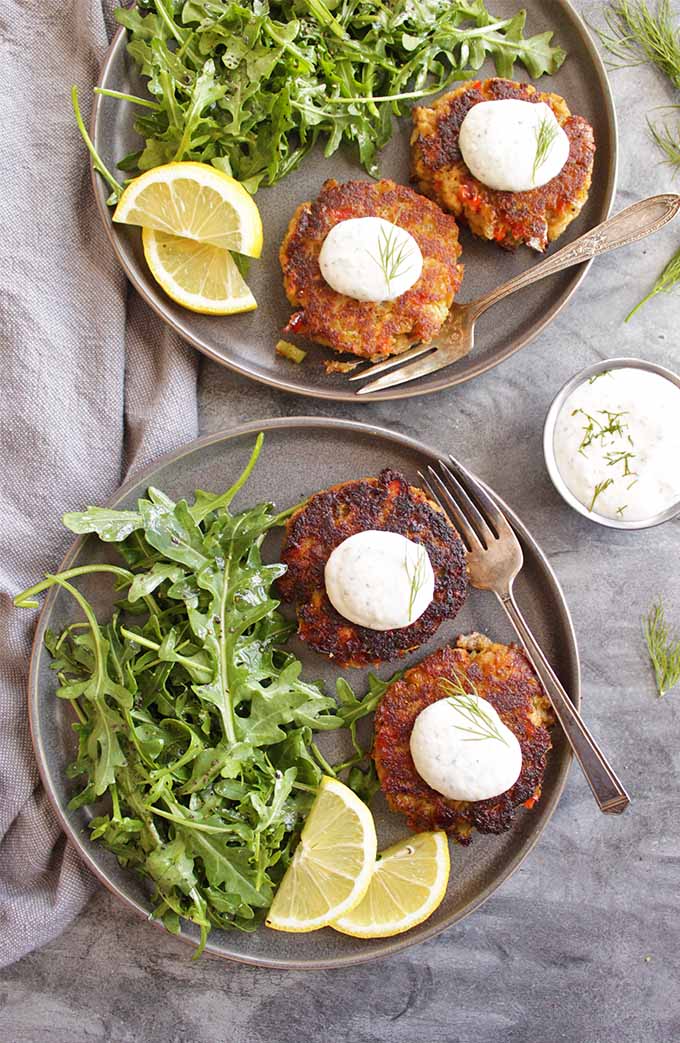 Easy Salmon Cakes with Greek Yogurt Horseradish Dip - Pantry/fridge staple salmon cakes that are perfect for a weeknight dinner, yet special enough to serve to guests. This recipe only takes 40 minutes to make and is gluten free! One of my favorite go-to meals! | robustrecipes.com
