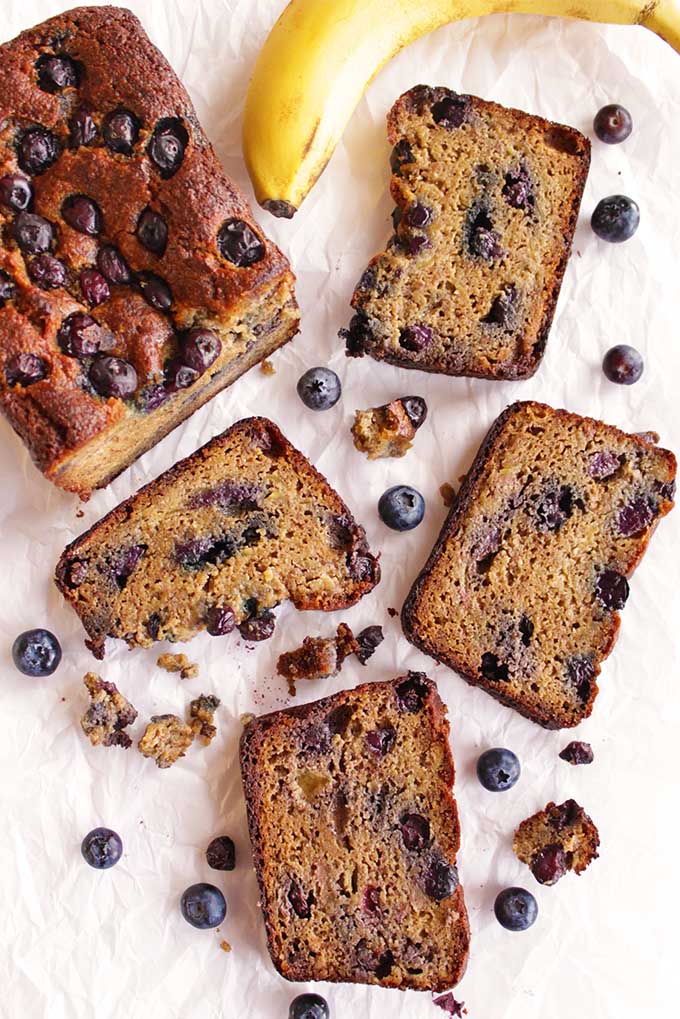 Blueberry banana bread - Sweet and tender banana bread studded with fresh blueberries. This blueberry banana bread is gluten free, grain free, and only requires 12 ingredients. It's perfect for breakfast, a snack, or as a healthier dessert. A must try recipe for all of the cozy feels! | robustrecipes.com
