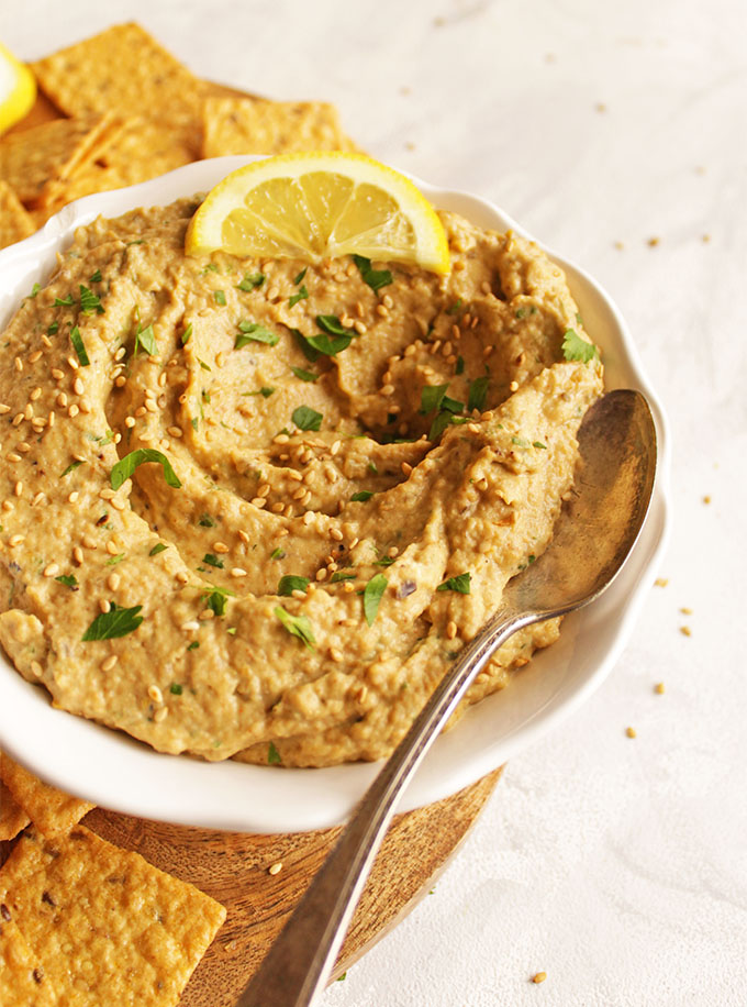 Roasted Baba Ganoush is a creamy Middle Eastern dip made from roasted Eggplants. This method is easy to make - no need to drain the eggplant. Serve with crackers, or pita chips for in intriguing dip that's perfect for any party or as an appetizer to any meal! Gluten Free | robustrecipes.com