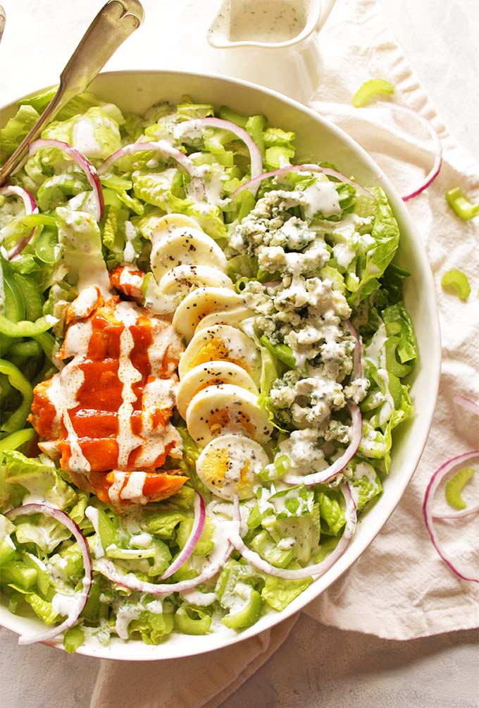 Buffalo Chicken Salad with Greek Yogurt Ranch Dressing - satisfies the craving for buffalo chicken wings only with more veggies. It's packed with crunch, spicy buffalo sauce, and homemade cooling Greek yogurt ranch dressing. So tasty! #Glutenfree #buffalochicken #recipes #salad #healthyfood | robustrecipes.com