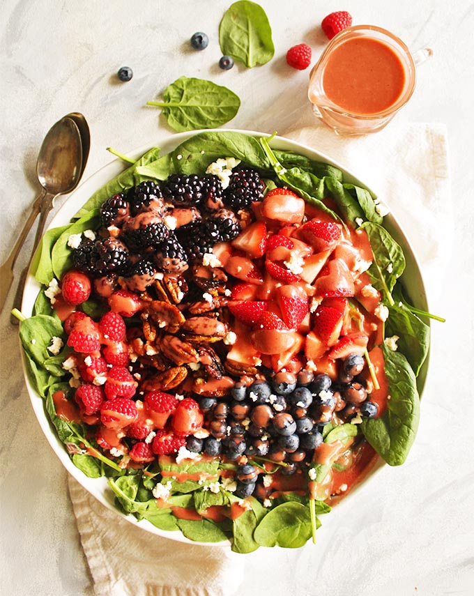  Berry Spinach Salad with Raspberry Vinaigrette - loaded with berries, candied maple pecans, honey goat cheese, & homemade raspberry vinaigrette. The ultimate summer salad recipe! #Salad #berries #summer #vegetarian #glutenfree #vegan | robustrecipes.com
