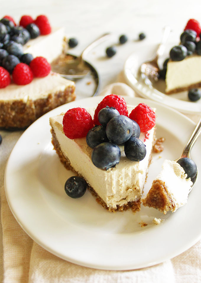 No bake cheesecake is perfect for summer. It's doesn't require any heat to make, and it's topped with any kind of fresh fruit you prefer. Rich, creamy, fruity, and refreshing  you'll love this dessert! Plus, it's vegan and gluten free, but you will never be able to tell! #cheesecake #vegan #glutenfree #summer #dessert | robustrecipes.com