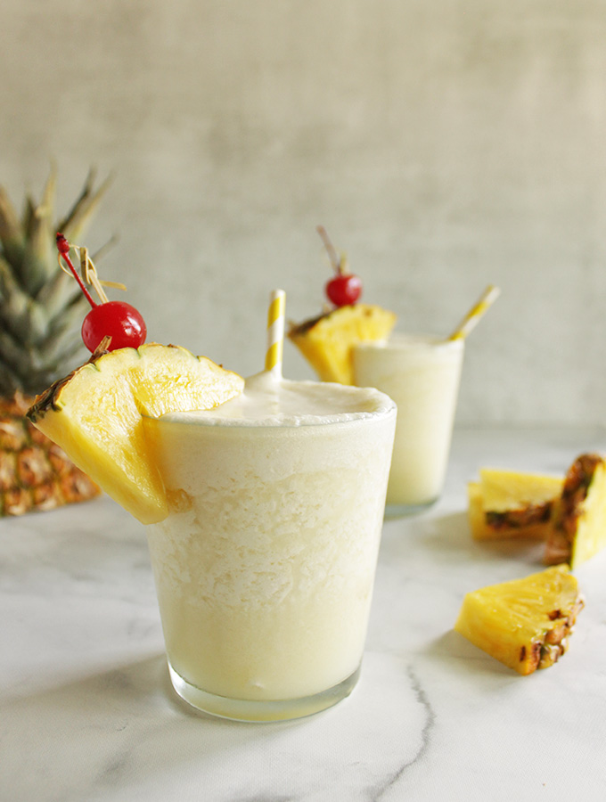 Healthier Pina Colada - frosty, creamy, and perfectly sweet. it's made without any artificial flavors or sweeteners, just wholesome ingredients. Perfect summer cocktail. #cocktail #summer #easyrecipe #pinacolada
