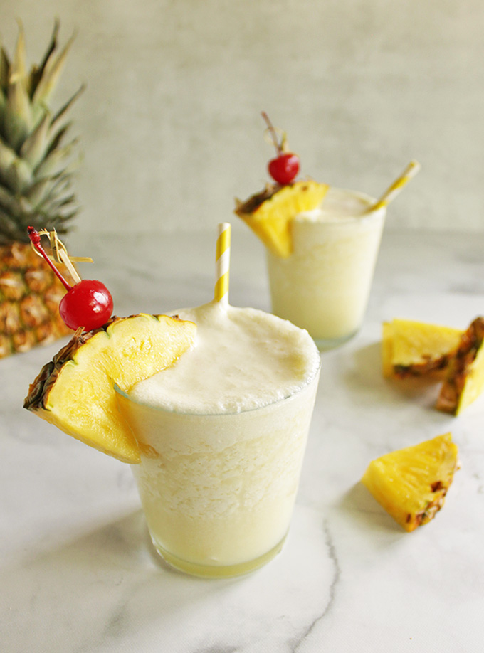 Healthier Pina Colada - frosty, creamy, and perfectly sweet. it's made without any artificial flavors or sweeteners, just wholesome ingredients. Perfect summer cocktail. #cocktail #summer #easyrecipe #pinacolada