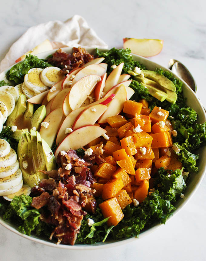 Fall Cobb Salad with Butternut Squash - loaded with fall produce such as roasted butternut squash and crunchy apples. It still has a lot of the classics: avocado, hard boiled eggs, and bacon. This is a great entree salad! #fall #recipes #glutenfree #cleaneating | robustrecipes.com