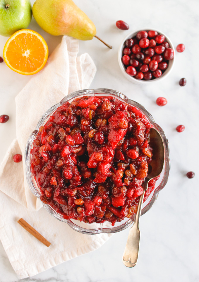 Favorite Cranberry Apple Pear Sauce - the perfect side dish for Thanksgiving or Christmas. It's packed with saucy cranberries, apples, pears, and sweet raisins. #Thanksgiving #recipes #vegan #glutenfree