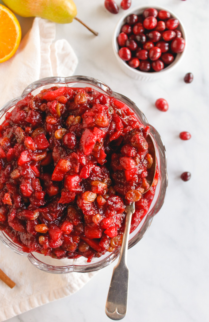 Favorite Cranberry Apple Pear Sauce - the perfect side dish for Thanksgiving or Christmas. It's packed with saucy cranberries, apples, pears, and sweet raisins. #Thanksgiving #recipes #vegan #glutenfree
