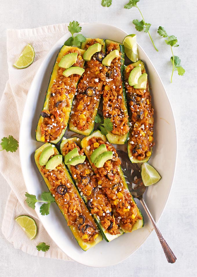 Taco Stuffed Zucchini Boats - all the taco flavors stuffed into a zucchini. This balanced, veggie packed meal is perfect for a weeknight or a make-ahead dinner. #easyrecipes #glutenfree #tacos #healthyfood | robustrecipes.com