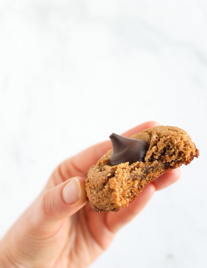  Peanut Butter Blossom Cookies (Gluten Free) - soft and chewy peanut butter cookies with a dark chocolate kiss in the center. They are easy to make and gluten free. Extra special for the Holidays but perfect any time of year. #glutenfree #easyrecipe #recipe #peanutbutter #chocolate #baking | robustrecipes.com
