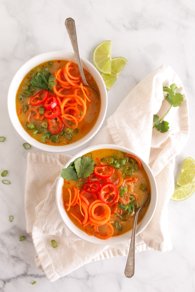 Thai carrot noodle soup with chicken - flavorful and healthy soup that's super satisfying. Sweet, a little spicy, and tangy with crunchy carrot noodles and tender shredded chicken. 35 Minutes to make and only needs one pan, the perfect weeknight meal. #glutenfree #dairyfree #weeknightmeal #easyrecipe | robustrecipes.com