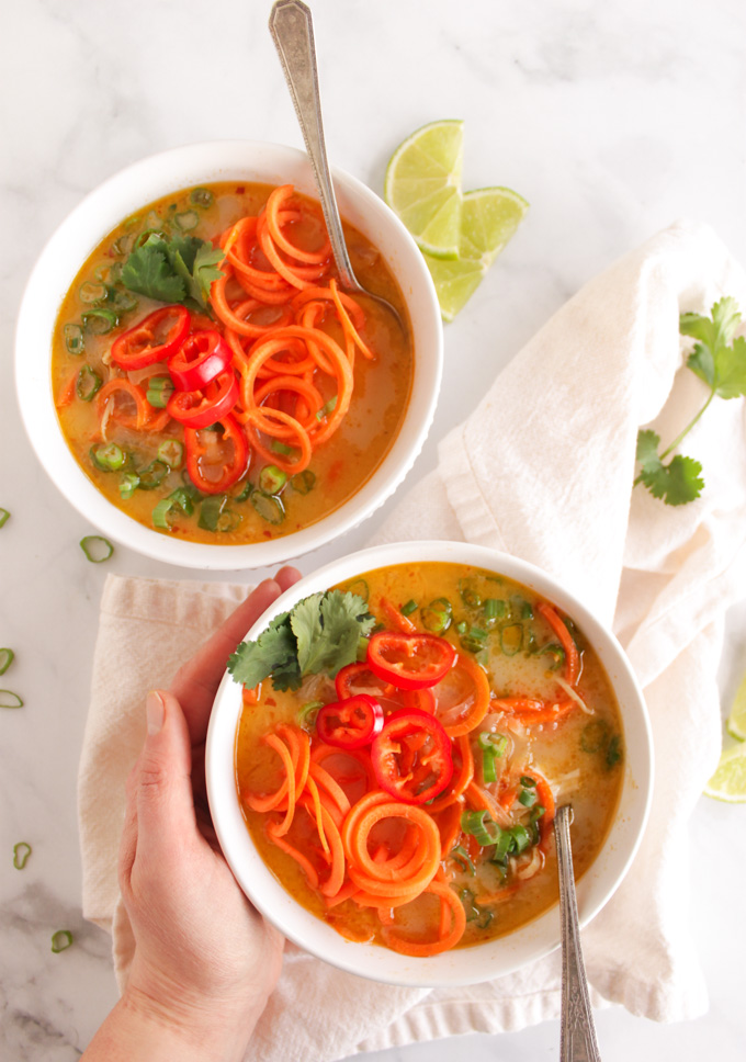 Thai carrot noodle soup with chicken - flavorful and healthy soup that's super satisfying. Sweet, a little spicy, and tangy with crunchy carrot noodles and tender shredded chicken. 35 Minutes to make and only needs one pan, the perfect weeknight meal. #glutenfree #dairyfree #weeknightmeal #easyrecipe | robustrecipes.com