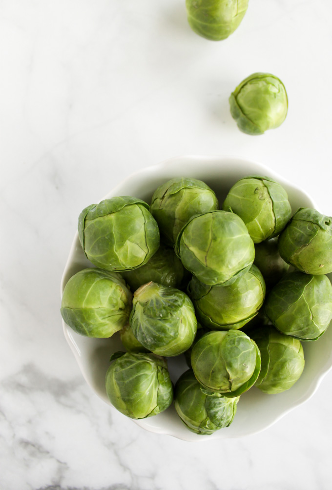 How to Make Roasted Brussels Sprouts - A simple guide on how to make roasted Brussels sprouts & guarantee they turn out crispy, charred, and tender every time. Makes the perfect side to any meal. #easyrecipes #vegan #vegetarian #glutenfree #howto | robustrecipes.com