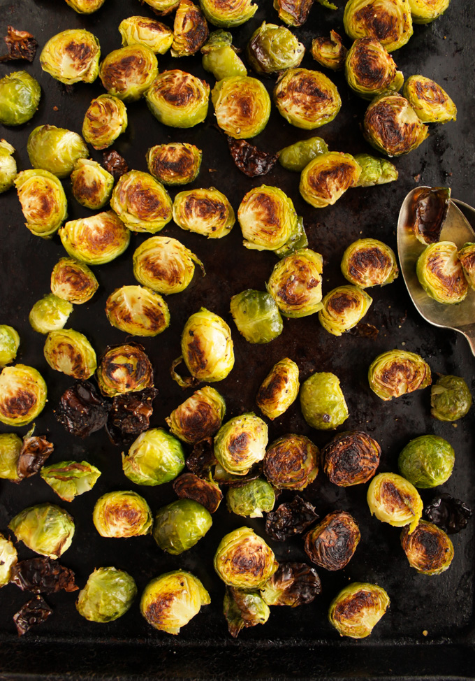 How to Make Roasted Brussels Sprouts - A simple guide on how to make roasted Brussels sprouts & guarantee they turn out crispy, charred, and tender every time. Makes the perfect side to any meal. #easyrecipes #vegan #vegetarian #glutenfree #howto | robustrecipes.com
