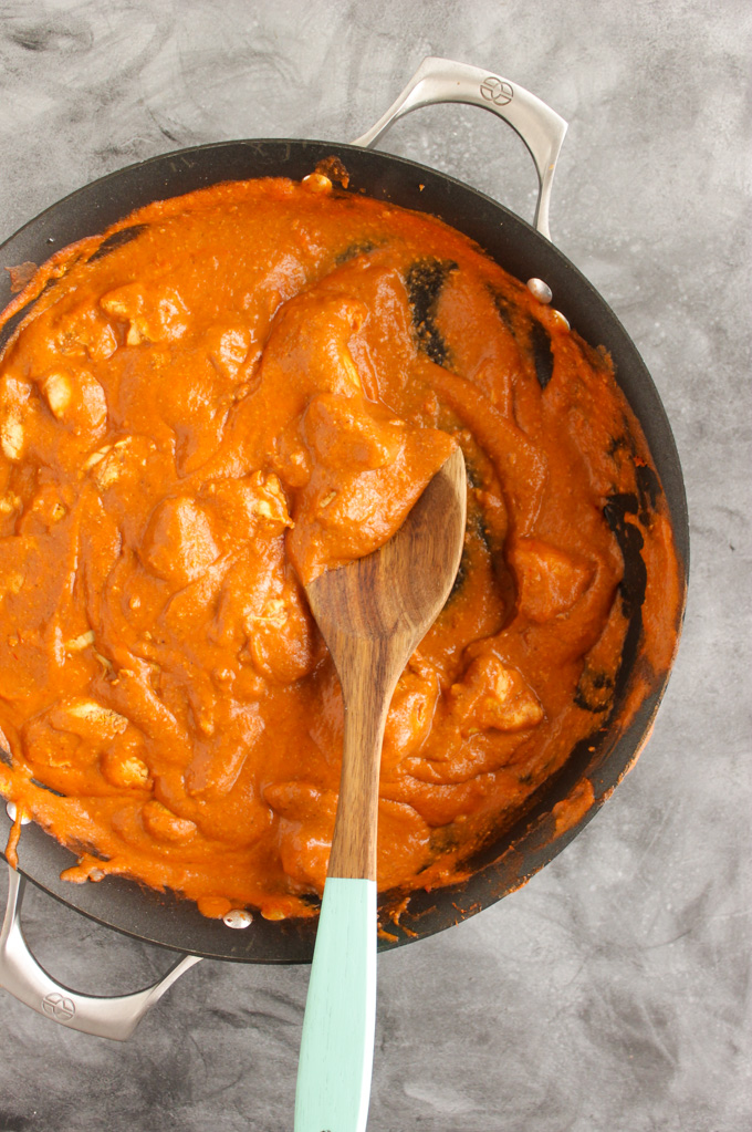 Lighter Butter Chicken - is flavorful Indian dish with tender chicken and a velvety smooth sauce. This recipe uses simple, easy to find ingredients, and is easy to make (30 minutes). It's made lighter by using cashew milk instead of heavy cream in the sauce. #glutenfree #easyrecipe #chicken #indainfood #weeknightdinner #dinner #recipe | robustrecipes.com