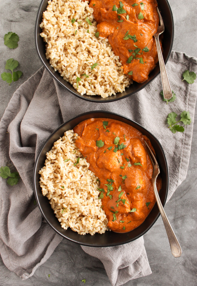 Lighter Butter Chicken - is flavorful Indian dish with tender chicken and a velvety smooth sauce. This recipe uses simple, easy to find ingredients, and is easy to make (30 minutes). It's made lighter by using cashew milk instead of heavy cream in the sauce. #glutenfree #easyrecipe #chicken #indainfood #weeknightdinner #dinner #recipe | robustrecipes.com