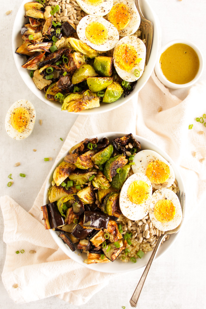 Brussels Sprouts Eggplant Buddha Bowl - Warm roasted veggies piled on top of quinoa! SO YUM! An easy & healthy recipe that only takes 30 minutes to make. Vegan option too! #glutenfree #vegetarian #easyrecipe #healthyrecipe #salad #bowl #weeknightdinner #quinoa | robustrecipes.com