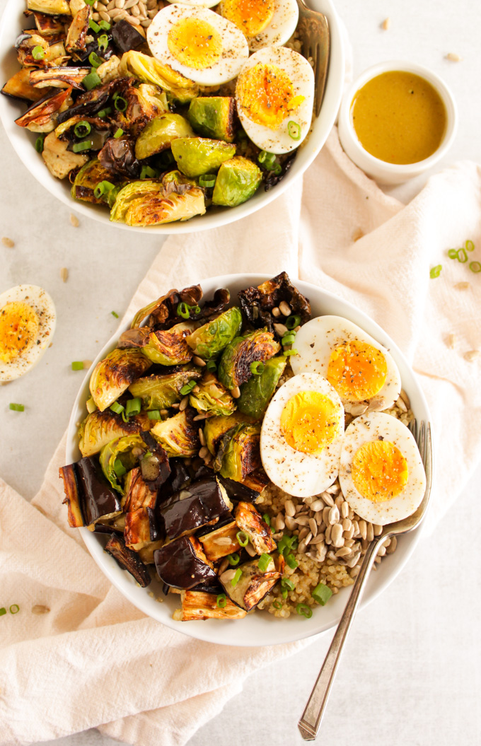 Brussels Sprouts Eggplant Buddha Bowl - Warm roasted veggies piled on top of quinoa! SO YUM! An easy & healthy recipe that only takes 30 minutes to make. Vegan option too! #glutenfree #vegetarian #easyrecipe #healthyrecipe #salad #bowl #weeknightdinner #quinoa | robustrecipes.com