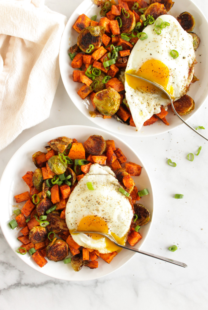 Roasted Sweet potato hash with Brussels sprouts and a fried egg is a healthy and satisfying weekend breakfast that also works great for dinner. Well balanced and nutrition packed this recipe will keep you full until the next meal. #breakfast #sweetpotatoes #healthyrecipe #easyrecipe #weeknightdinner #eggs #glutenfree #vegetarian | robustrecipes.com