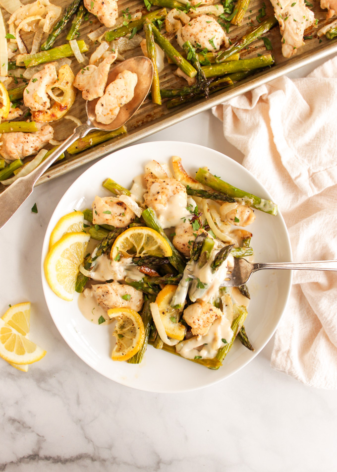 Sheet Pan Chicken and Asparagus with Lemon Tahini Sauce - an easy 30 minute dinner perfect for busy weeknights. That lemon tahini sauce makes this recipe extra special! #chicken #weeknightdinner #easyrecipe #glutenfree #dairyfree #chicken #asparagus #easyrecipe | robustrecipes.com