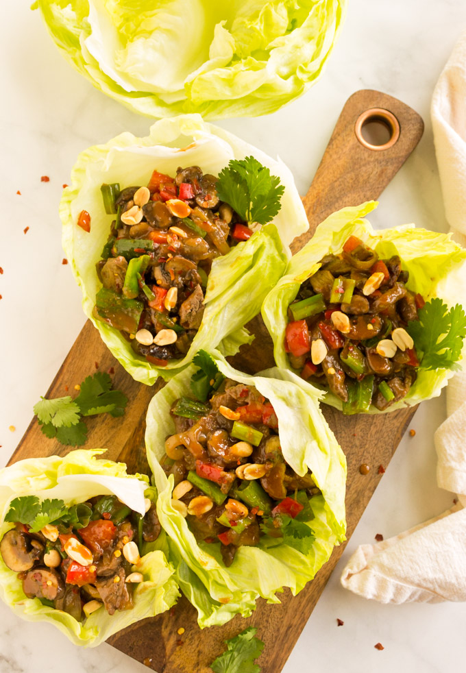  Easy Beef Lettuce Wraps with Peanut Sauce - Asian inspired beef lettuce wraps are the perfect meal for busy weeknights, requires one pan and less than 30 minutes to make. Lite, packed with veggies, and bold flavor these will become a weekly favorite. #glutenfree #dairyfree #easyrecipe #weeknightmeal #onepan #cleaneating #healthy #recipe #beef #peanutbutter #peanutsauce #asianrecipe | robustrecipes.com