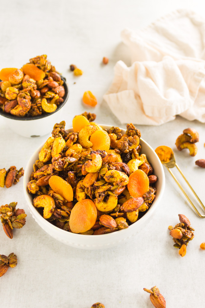 Slow Cooker Curried Trail Mix - Curried trail mix made in the slow cooker. It's savory-sweet, spicy, and packed with crunch. Loaded with energizing ingredients making it the perfect on-the-go snack. #trailmix #glutenfree #healthysnack #snack #vegan #snacktime #dairyfree #healthy #turmeric #curry #apricots #cashews #almonds #slowcooker #easyrecipe | robustrecipes.com