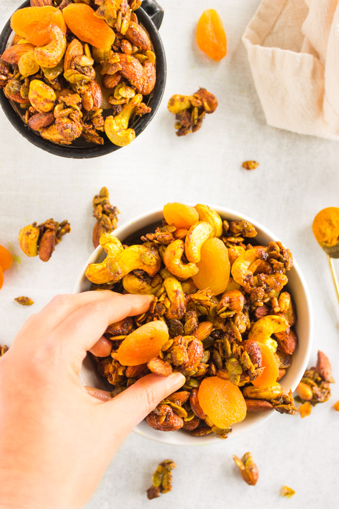Slow Cooker Curried Trail Mix - Curried trail mix made in the slow cooker. It's savory-sweet, spicy, and packed with crunch. Loaded with energizing ingredients making it the perfect on-the-go snack. #trailmix #glutenfree #healthysnack #snack #vegan #snacktime #dairyfree #healthy #turmeric #curry #apricots #cashews #almonds #slowcooker #easyrecipe | robustrecipes.com