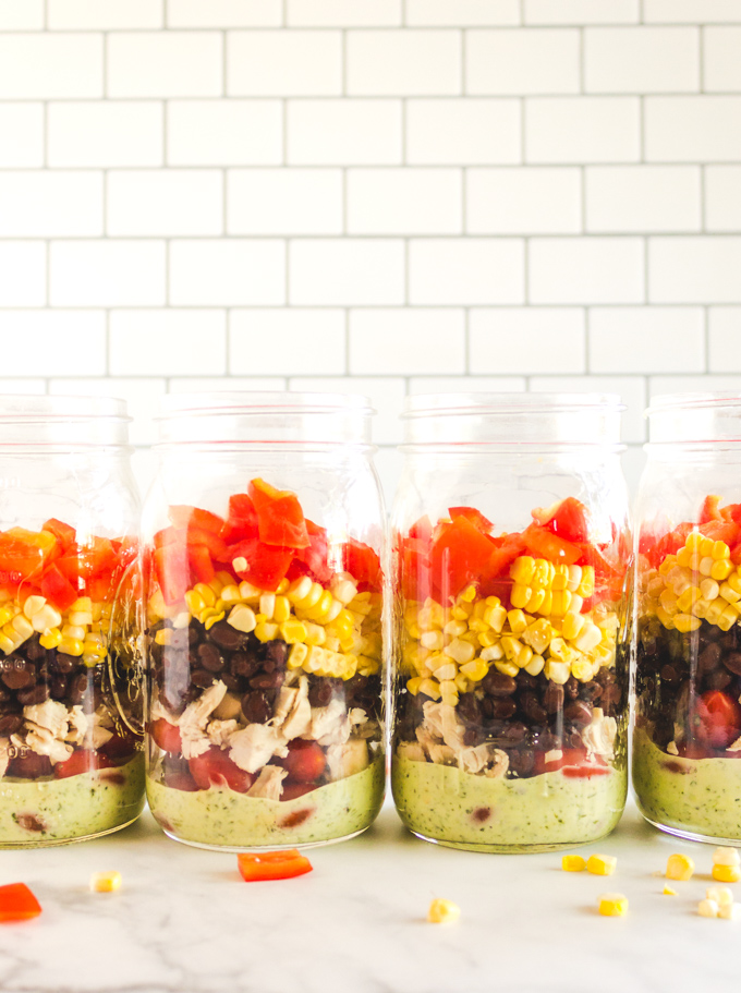 Mexican Salads in a Jar with Healthy Ranch Dressing - packed with all the Mexican veggies. Perfect for meal prep. They stay fresh for 4 days, great for packed lunches or picnics. Packed with all the Mexican veggies. #salads #mealprep #chicken #summer #easyrecipe #lunch #packedlunch #worklunch #healthy #saladsinajar #masonjarsalads #ranchdressing #greekyogurt #jalapeno #entree #corn | robustrecipes.com