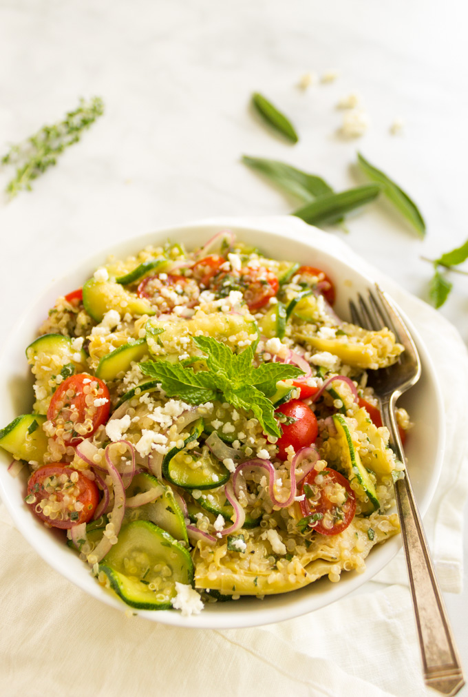 Raw zucchini quinoa salad with lemon herb vinaigrette is the ultimate summer salad to make the most of garden fresh ingredients. A great side salad to any meal, also is great for meal prep or packed lunches. #glutenfree #salad #side #dairyfree #vegetarian #vegan #zucchini #quinoa #tomatoes #herbs #cleaneating #healthy #easyrecipe #mealprep #garden | robustrecipes.com