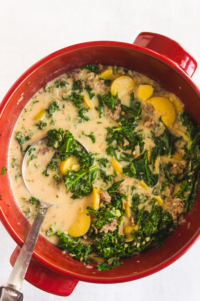 Dairy free Zuppa Toscana - a healthier version of Olive Garden's Zuppa Toscana soup. It's made dairy free by using cashew cream. Hearty, creamy, and spicy. It's easy to make, perfect for a weeknight dinner! #dairyfreesoup #cashewcream #healthyrecipe #souprecipe #glutenfreesoup #Italian #weeknightdinner | robustrecipes.com