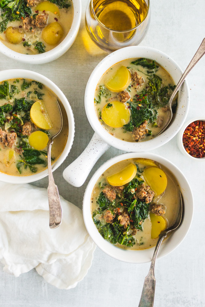 Dairy free Zuppa Toscana - a healthier version of Olive Garden's Zuppa Toscana soup. It's made dairy free by using cashew cream. Hearty, creamy, and spicy. It's easy to make, perfect for a weeknight dinner! #dairyfreesoup #cashewcream #healthyrecipe #souprecipe #glutenfreesoup #Italian #weeknightdinner | robustrecipes.com