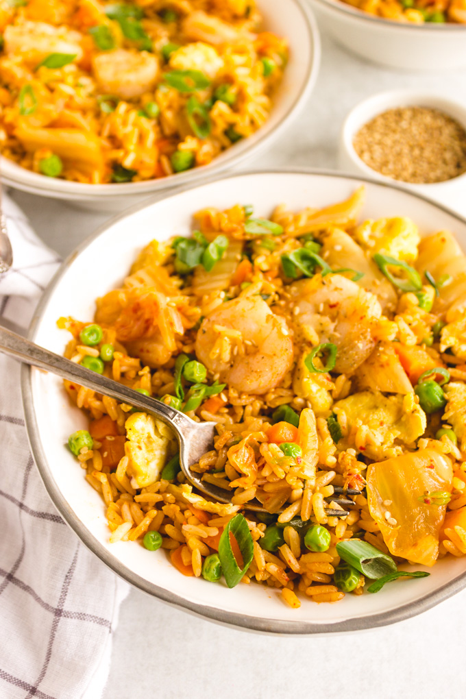 Kimchi Fried Rice with Shrimp (30 Minutes) - Kimchi fried rice is restaurant quality fried rice that you can make at home. It's packed with probiotics from the kimchi. It only takes 30 minutes, and one pan to make, perfect for a weeknight dinner. #shrimprecipe #friedrice #kimchi #glutenfreerecipe #30minutemeal #onepanmeal | robustrecipes.com