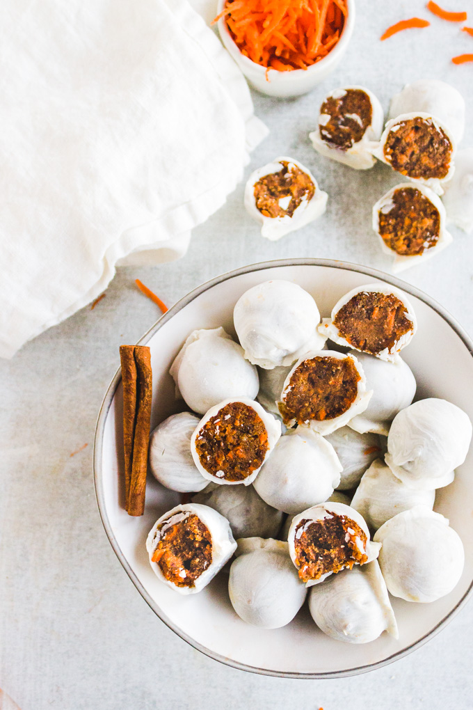 No Bake carrot cake balls - little bites of carrot cake heaven. They're easy to make, a healthier dessert, and perfect anytime you want a taste of carrot cake without having to bake. #carrotcake #glutenfreerecipe #dairyfreerecipe #veganrecipe #vegandessert #dairyfreedessert #coonutbutter #dates #healthydessert | robustrecipes.com