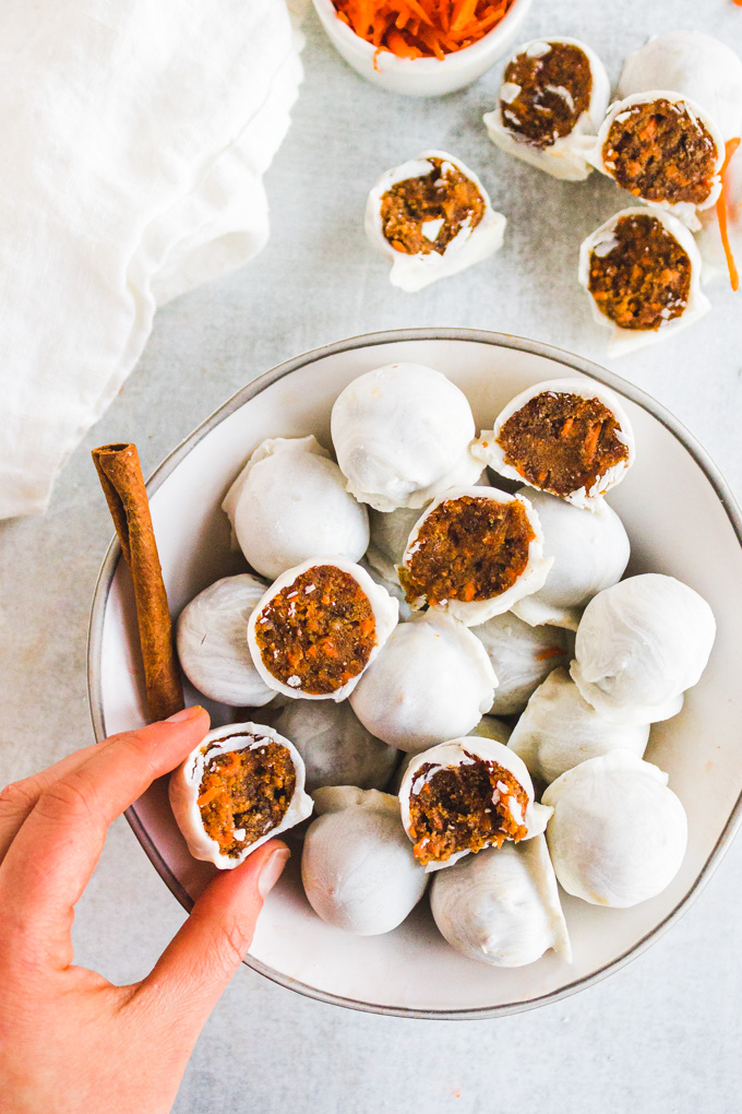 No Bake carrot cake balls - little bites of carrot cake heaven. They're easy to make, a healthier dessert, and perfect anytime you want a taste of carrot cake without having to bake. #carrotcake #glutenfreerecipe #dairyfreerecipe #veganrecipe #vegandessert #dairyfreedessert #coonutbutter #dates #healthydessert | robustrecipes.com