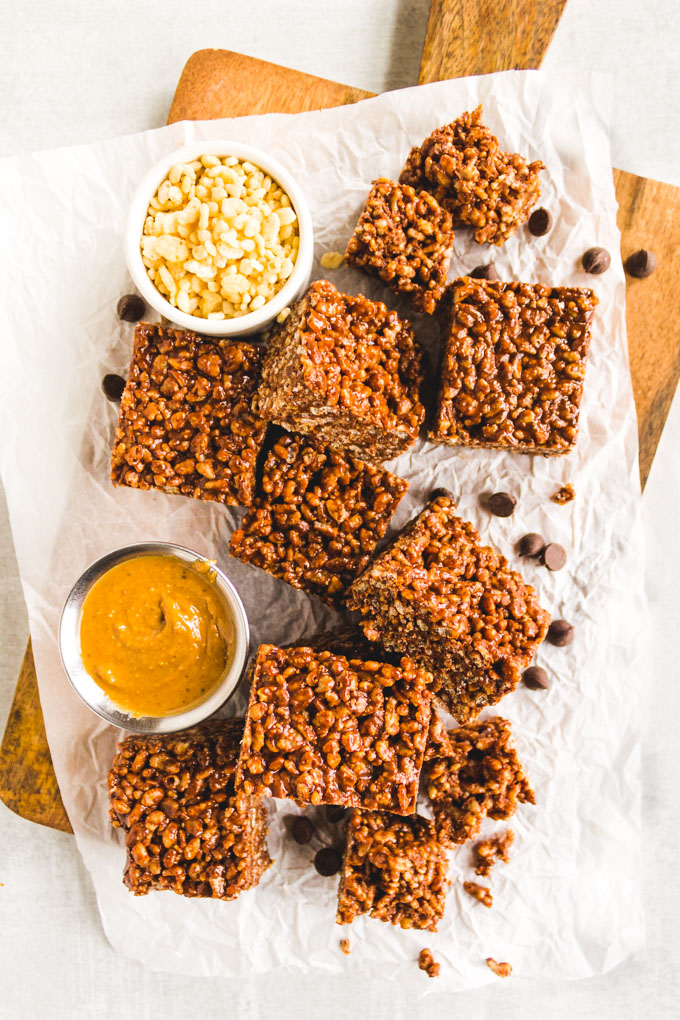 Peanut butter and chocolate puffed rice treats are a slightly healthier version of rice crispy treats. Only requires 6 ingredients and 15 minutes to make. #dessert #glutenfreedessert #dairyfreerecipe #chocolate #ricecrispycereal #nobakerecipe #easyrecipe | robustrecipes.com